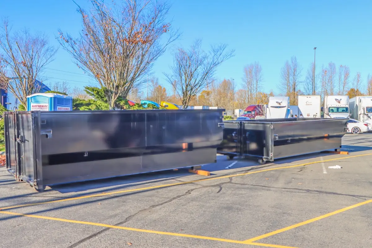 Professional dumpster rental service with roll-off container on residential driveway in Petaluma